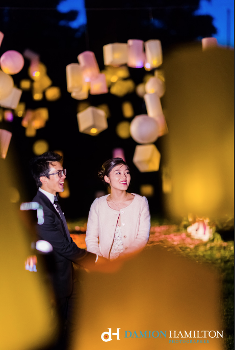 Tangled fairytale wedding proposal with couple together underneath lantern lights