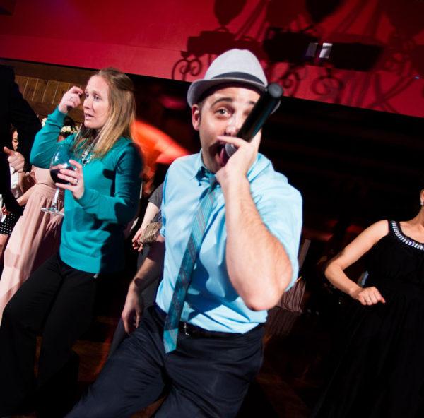 dj mc at a social event on the dance floor with guests