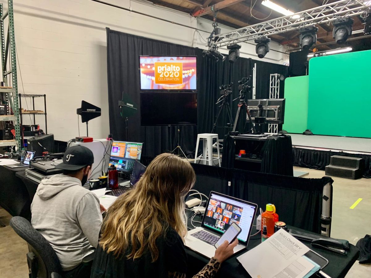 Behind the scenes production with computer tech set-up and green screen for virtual meetings and conferences