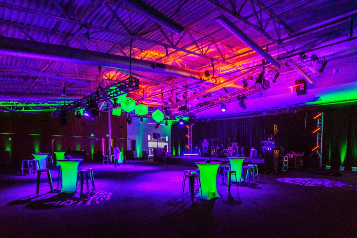 Multicolored venue up lighting and floor pattern wash for corporate event