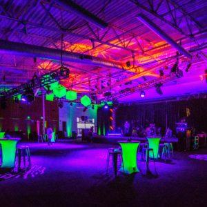Multicolored venue lighting for event.