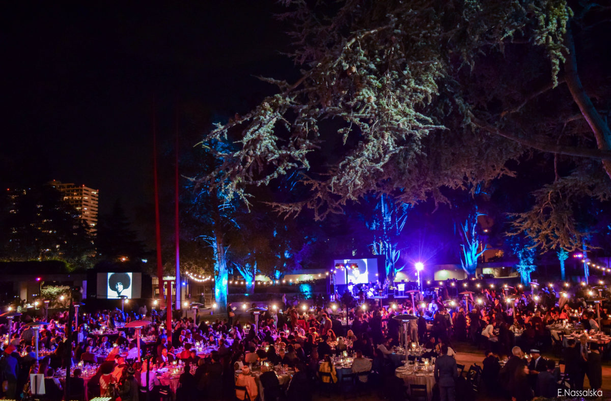 Outdoor bistro lighting for large crowd with string lights, tree lights and digital screens